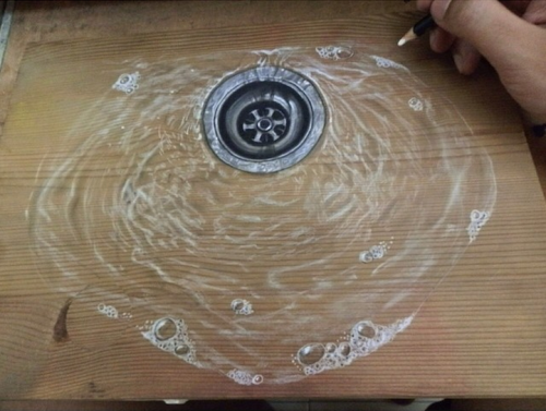 loraclespeaks:  archiemcphee:  Singapore-based visual artist and art instructor Ivan Hoo uses colored pencils and pastels to create awesome illustrations on wood panels that are both photorealistic and anamorphic. Hoo’s meticulous drawings look so incredi