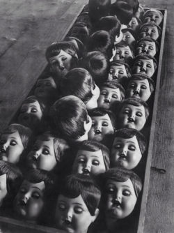 twenty1-grams:  The row of dolls heads in a factory in Germany circa 1950. 