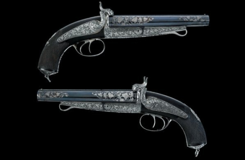A Luxury Cased Garniture of silver decorated double barrel pinfire pistols and a double barrel pinfi