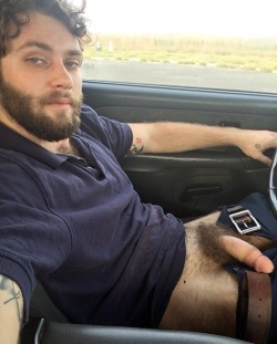 tgibush-hour:Damn, what a sexy fucker. From the looks of what’s creeping out the top of his shirt he’s got a nice hairy chest too. Woof!