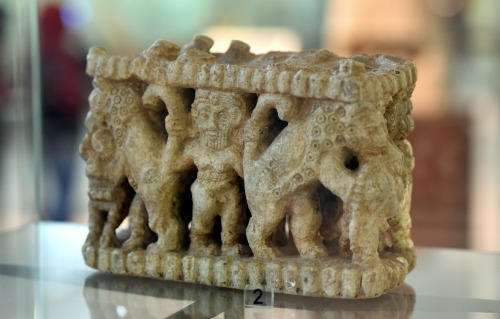 Sumerianstone sculpture with Gilgamesh wrestling two bulls; two lions alsoappear.  Found in the