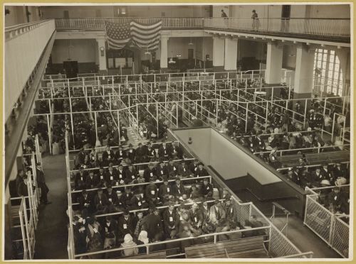 Immigrants wait in pens after passing a mental screen at Ellis Island, early 1900s. Twelve million i