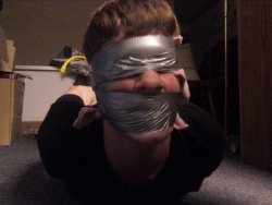 tugboys:  Duct tape gagged and blindfolded