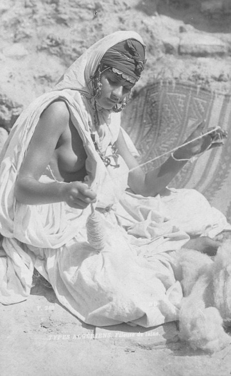 Portrait of a woman spinning wool somewhere in Algeria, c. 1870-1900. Published by French photograph