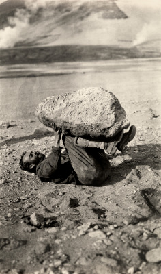 natgeofound:  A man balances a piece of pumice rock on his legs in Katmai National Park and Preserve, Alaska, September 1921.Photograph by Lucius G. Folsom, National Geographic