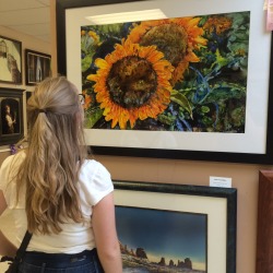 sunflowrrbabe:  Sunflower girl looks at sunflower