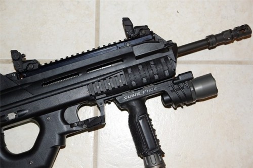 gunrunnerhell:  FN FS2000 The civilian model of the F2000, this 5.56x45/.223 bullpup consists of a largely polymer shell. Early models had an factory scope with housing that matched the overall aesthetics of the rifle. Current models ditch the scope and