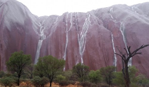 A rare rainfallUluru, that grand tan sandstone monolith gracing the desert wastes of Central Austral