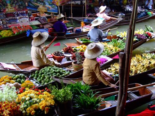 sixpenceee:  A floating market is a market where goods are sold from boats. Originating in times and