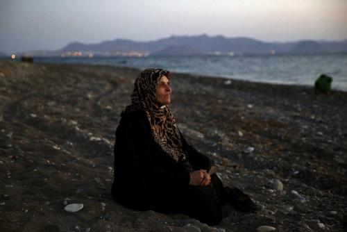 Amoun, 70, a blind Palestinian refugee who lived in the town of Aleppo in Syria, rests on a beach mo