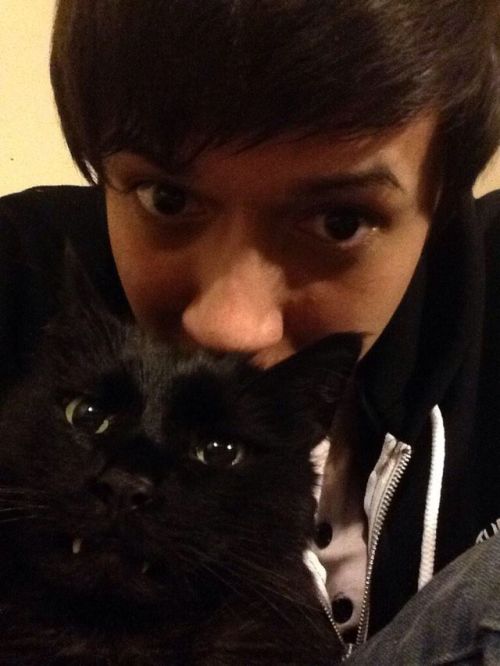 crittercreature: Kevin has the cutest fucking cat in existence ;w; TEETHY BLACK CATS ARE THE BEST CA