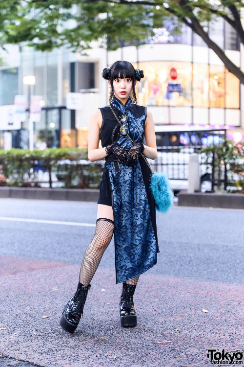 Harajuku shop staffer Misuru on the street wearing a twin buns hairstyle, black lace gloves, a Qutie