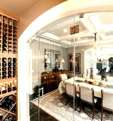 New York Wine CellarInspiration For A Small Timeless Dark Wood Floor Wine Cellar Remodel With Display
