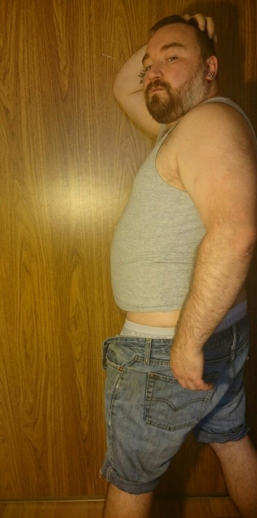 cuddlecubottawa:  I had a request for seeing me model in my favourite outfit. Somehow if was deleted but I took some pics anyways. This tank top is a bit tight around the belly, it makes me feel fat and I like that. These Jean shorts are probably the