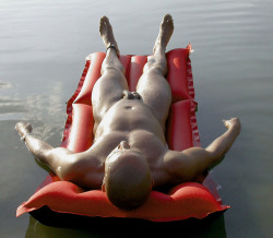 softissexy:  Brown man, red float 