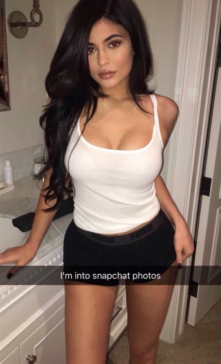 Kylie Jenner took to her Snapchat to flaunt her bulbous teen boobs in a tight white top