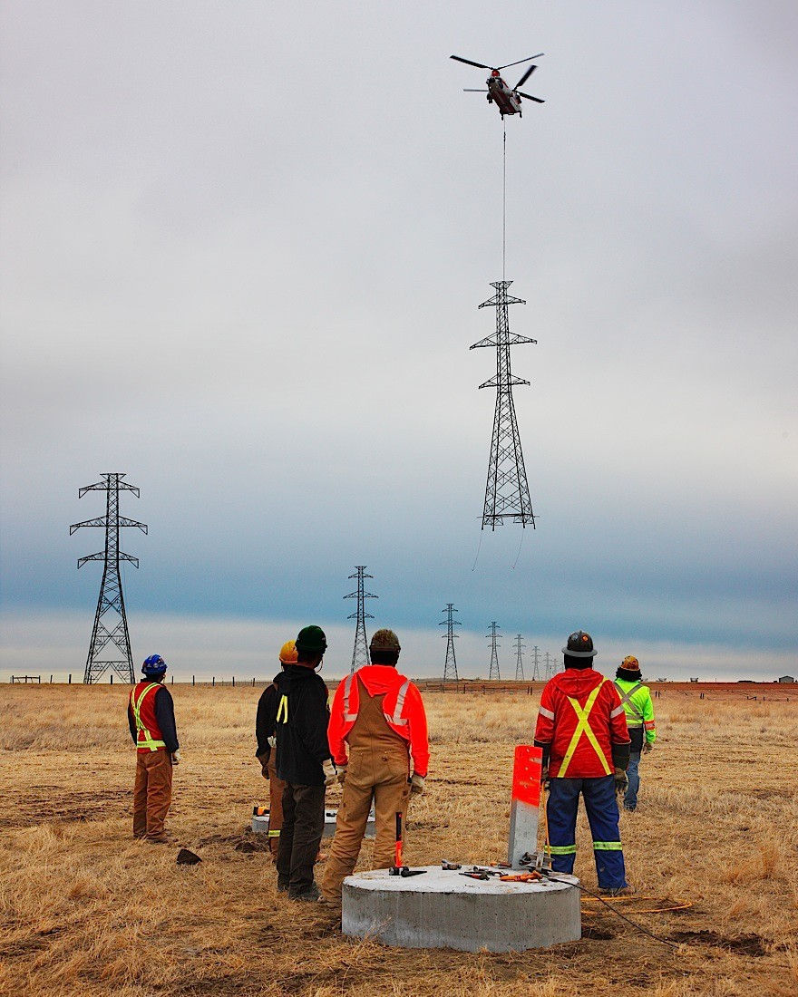 stunningpicture:  Installing a power line tower