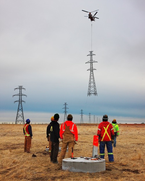 stunningpicture:  Installing a power line tower