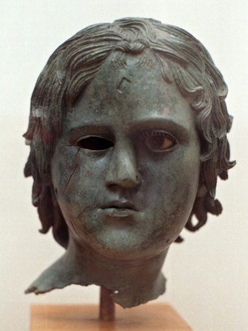 Damaged bronze head of a boy.  Artist unknown; Hellenistic period.  Now in the Archaeological Museum