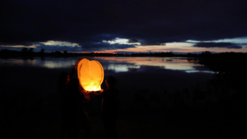 Oxford, England. Setting off a lantern in Port Meadow.