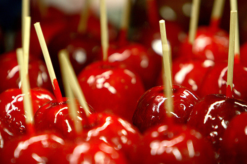 I candied apples in the night, dipping each fruit in molten sugar crimson with cochineal. Rows like 
