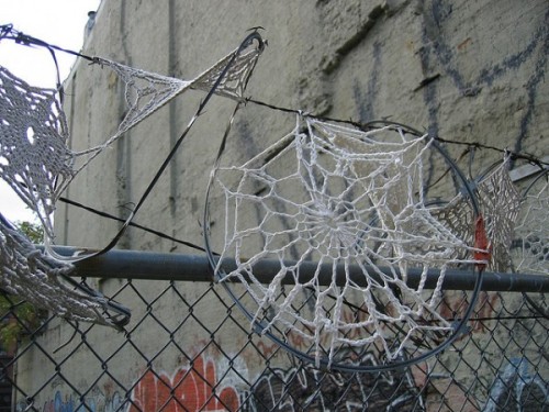 bombing:  Crystal Gregory - Invasive Doilies, 2011Crocheted doilies on razor wire fences in New York