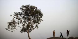 dastaanewatan:  Afghan refugee boys play on a hill near the slum where they live with their families, on the outskirts of Islamabad, Pakistan. Source: AP Photo/Muhammed Muheisen 