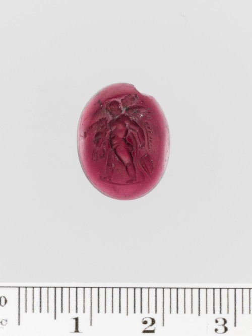 Garnet ring stone, 1st century B.C.Carved on this almandine garnet is Eros walking to the right and 