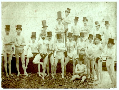 1863. Brighton swimming club being playful in chimney pot hats. Further information