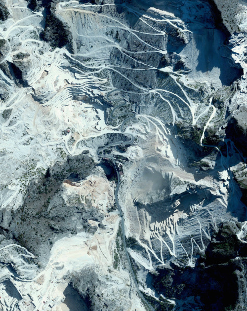 dailyoverview: Marble quarriers are visible in Carrara, Italy. The blue-grey marble that is extracte