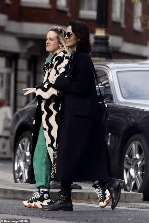 Michelle Dockery and friend on the town yesterday with enormous engagement ring.