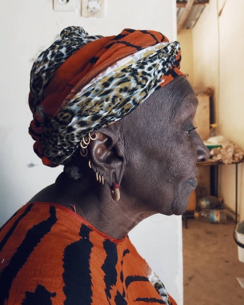 forafricans:  A portrait of a Fulani woman by Hawo Kane“I can’t stop taking pictures of my aunt. She’s one of the most beautiful Fulani woman of Podor and the inspiration behind all of my piercings.“–– Hawo Kane