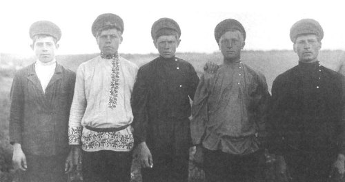 Young men wearing holiday attire in the village of Petrokovo, Yaroslavl Region, 1915.