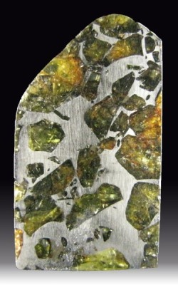 mineralists:  Pallasite is a variety of Meteorite that has Olivine crystals embedded inside a nickel iron matrix.Esquel, Argentina