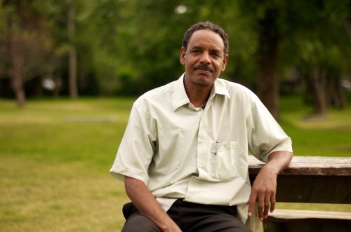 facesofnewfoundland:  This guy was the friendliest I’ve met in a long time- he was watching a baseball game at Bannerman Park when I approached him.“I’m sorry… little little English. Speak little little. I study at university. Sudan to Canada.
