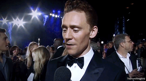 Tom Hiddleston having fun on the red carpet at the World Premiere of Thor: The Dark World in London,