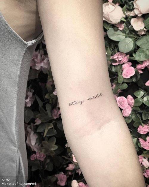 By MJ, done in Manhattan. http://ttoo.co/p/36017 bicep;english tattoo quotes;english;facebook;fine line;languages;line art;minimalist;mj;small;stay wild;quotes;twitter