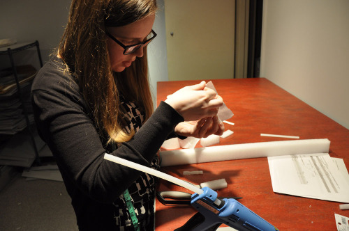 Registration Technician Chelsea Hick and Assistant Registrar Tessa Lummis are assembling three-dimen