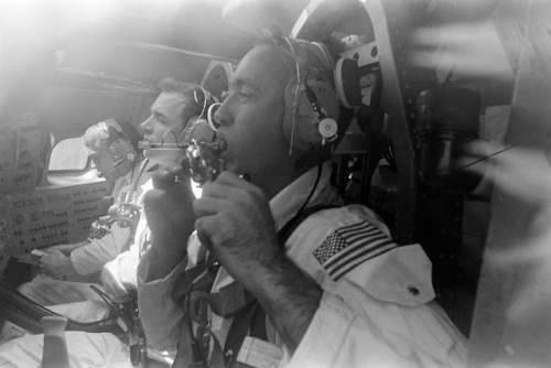 The prime crew of the Apollo 9 space mission are seen inside an Apollo command module boilerplate du