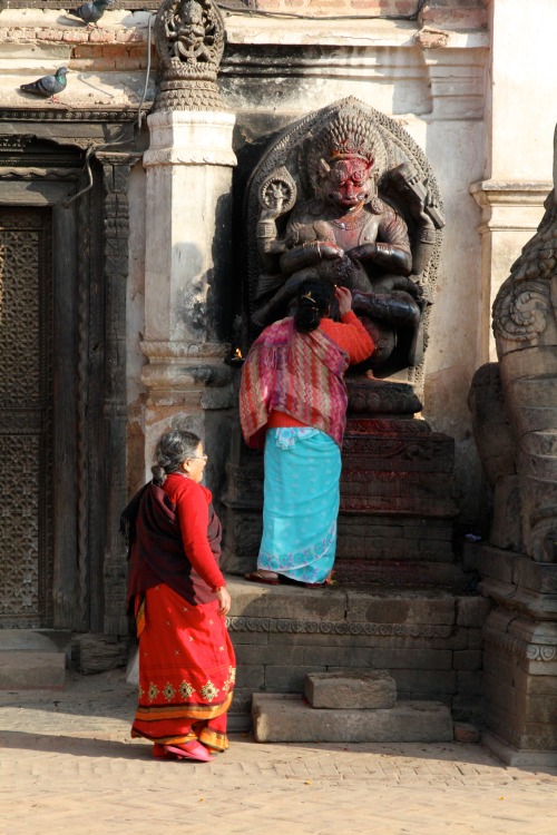 Woman worship lord Nrsimhadeva at Nepal