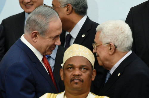Israeli and Palestinian leaders shake hands for first time in five years. And also get massively pho