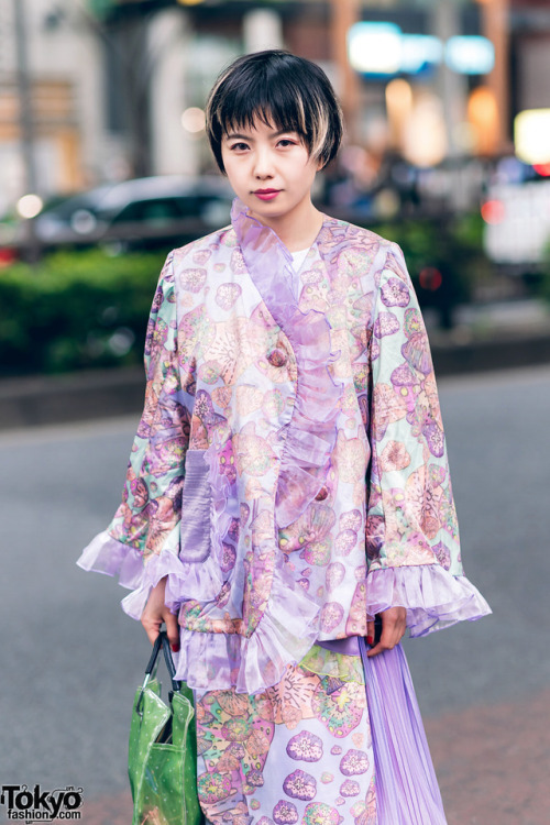 Fashion stylist Sho on the street in Harajuku wearing a graphic ruffle outfit by Kaoru Zhou with a B