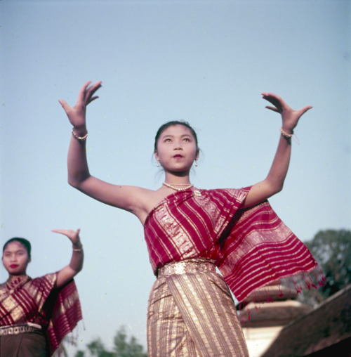 Schoolgirls in Laos performing traditional dances, 1955(via Library and Archives Canada)