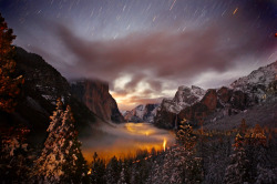awkwardsituationist:  yosemite in winter photographed by phil hawkins, with the mist light by passing cars.