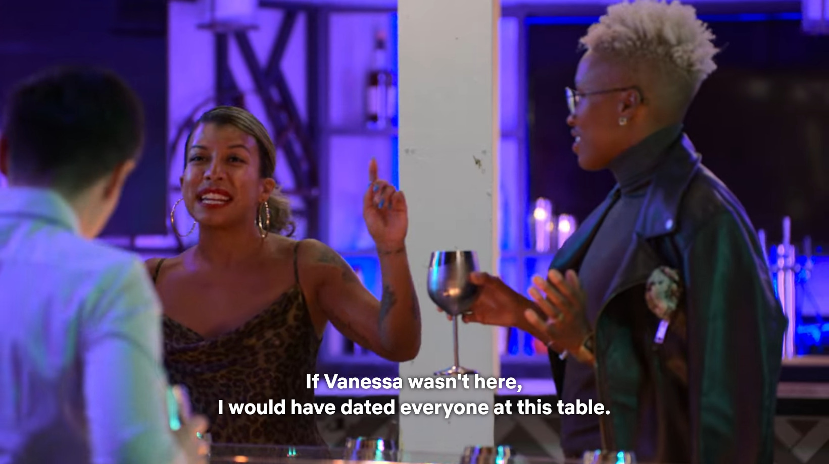 Yoly speaks to the group, saying, "If Vanessa wasn't here, I would have dated everyone at this table."