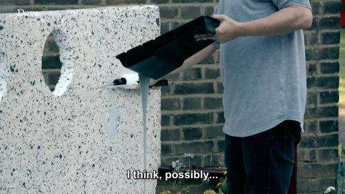 taskmastercaps:[ID: Two screencaps from Taskmaster. David Baddiel is in a garden, using a roller to paint on what appears to be a large board of grey foam. He’s holding a tray with paint spilling out of it. He says, “I think, possibly… possibly I’m going to make this quite shit.” End ID.] #Taskmaster#David Baddiel