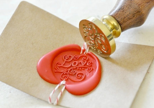 Why not fancy wax stamp? From BacktoZero on Etsy.