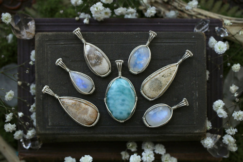 All these beautiful wire wrapped sterling silver agatized coral fossil, rainbow moonstone and larima