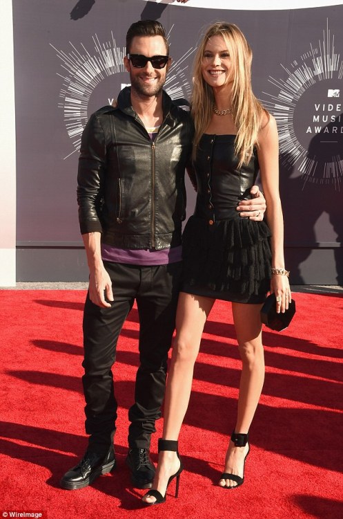 Newlyweds Adam Levine and Behati Prinsloo walk the red carpet at MTV VMAs for the first time since t