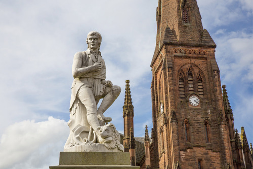 The statue of Robert Burns stands in the centre of Dumfries by Greyfriars Kirk